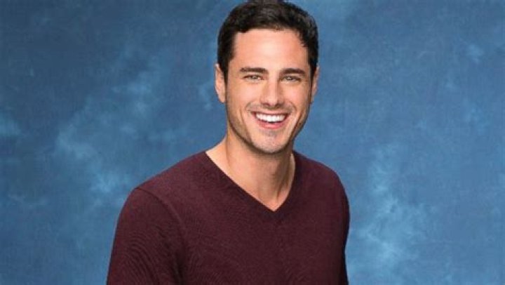 Ben Higgins on The Bachelor holding a rose