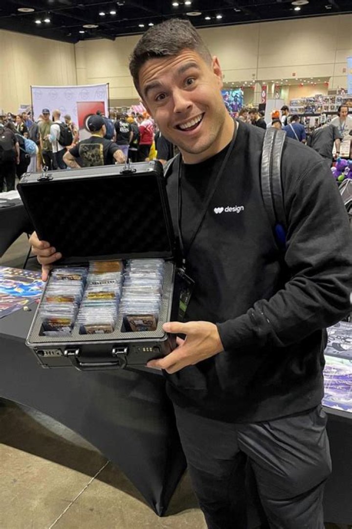 Blake Martinez With Pokemon Packs In His Hand