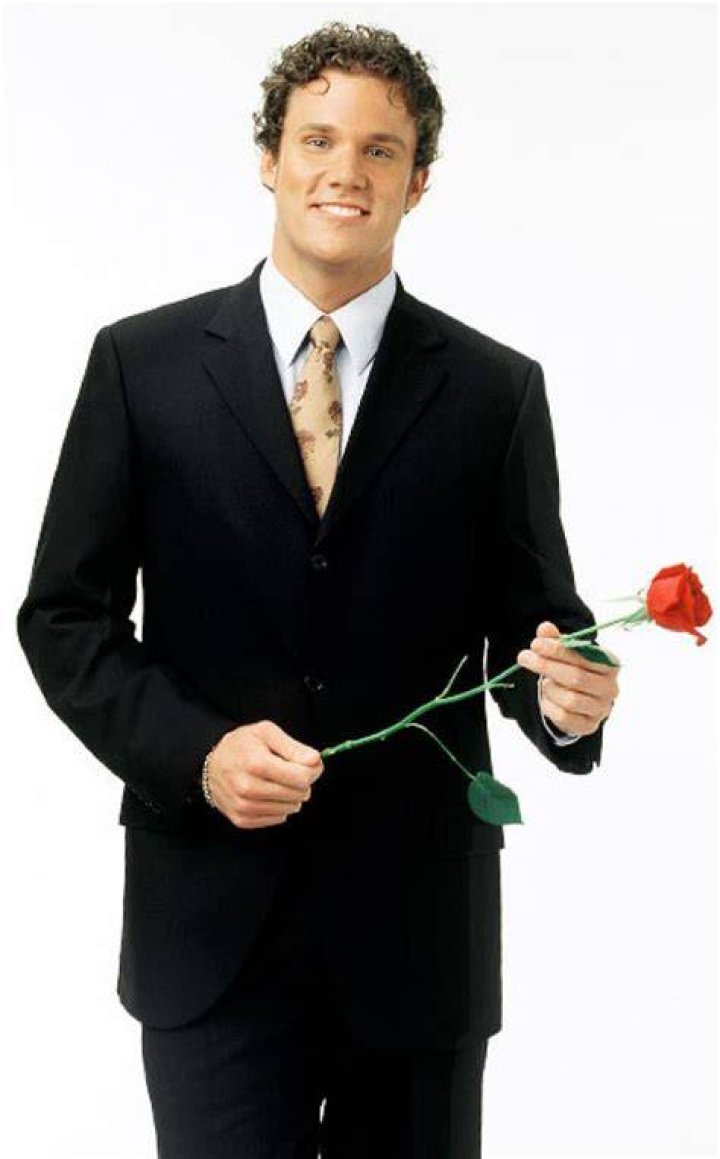 Bob Guiney The Bachelor Season 4 Smiling in black suit and white shirt