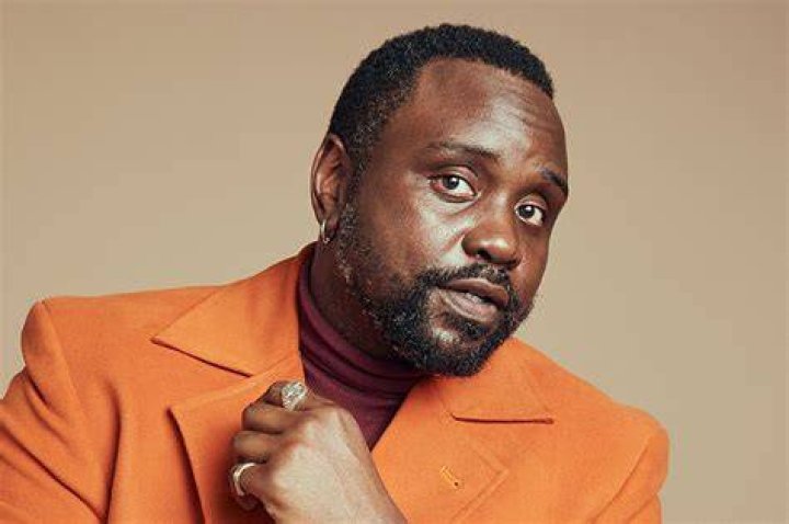 Brian Tyree Henry Brian Tyree Henry wearing a yellow and black suit