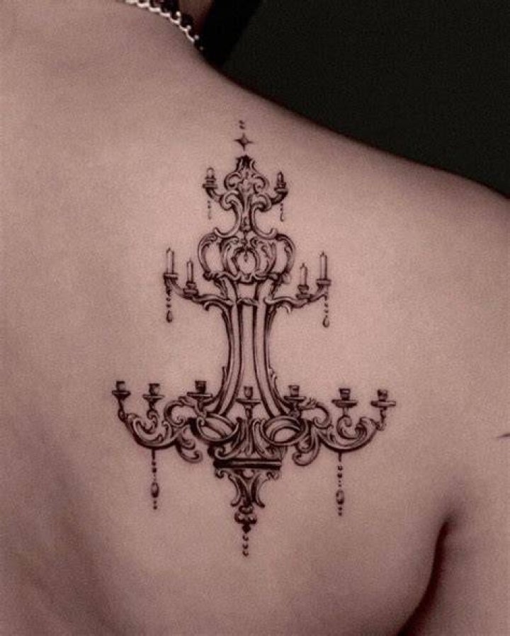 Chandelier arm tattoo on shoulder Zeal Tattoo