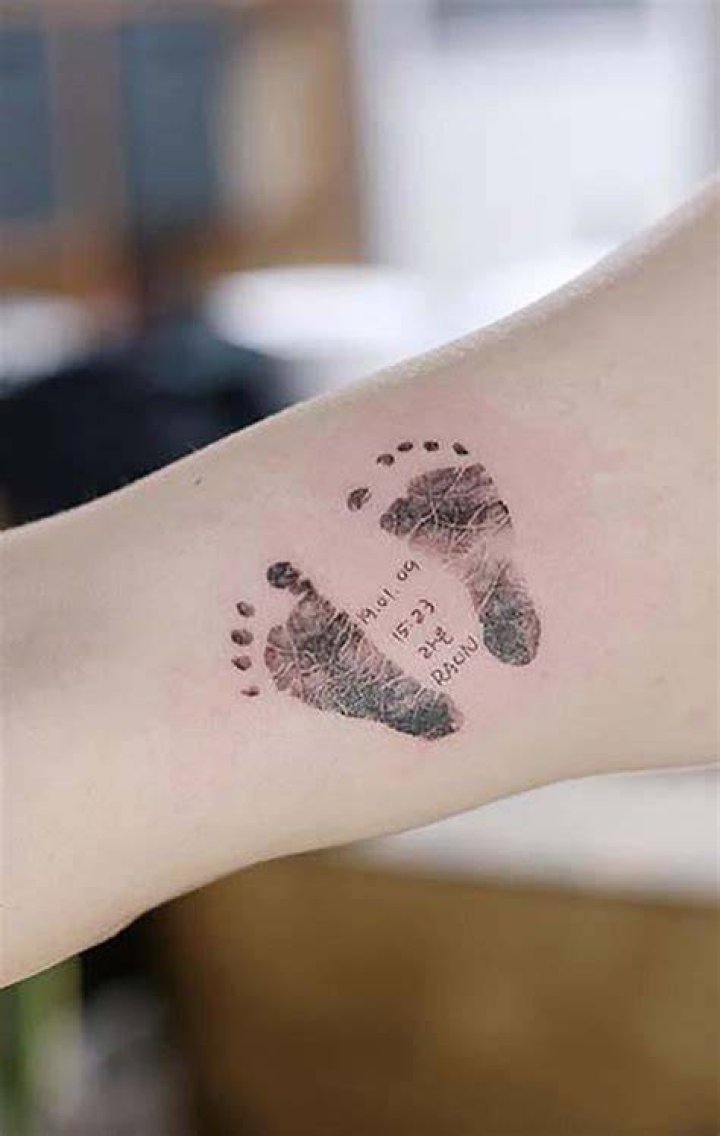 Foot print tattoo