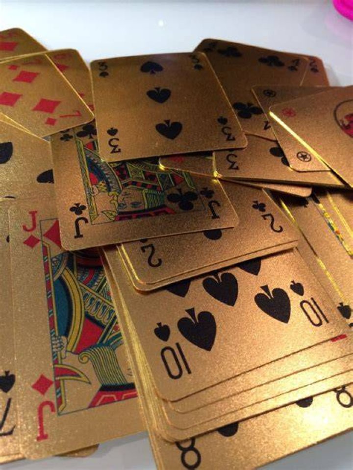 Green and gold playcards during Manchester United vs. Fulham match (Source: United in Focus)