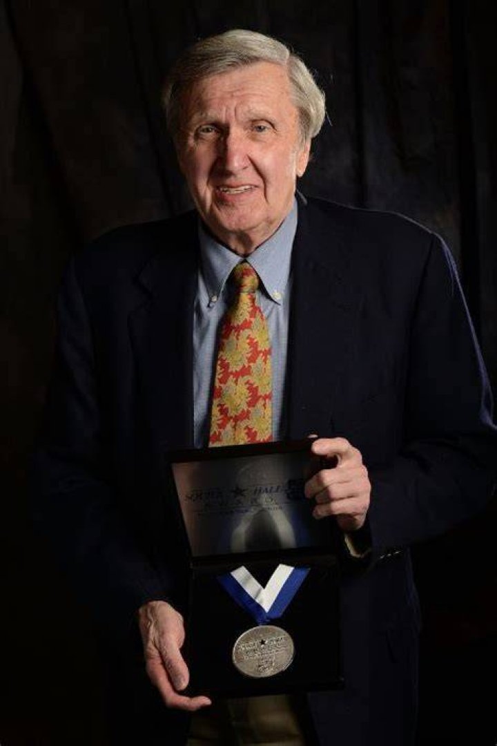 Ken Squier Showing Off His Medal