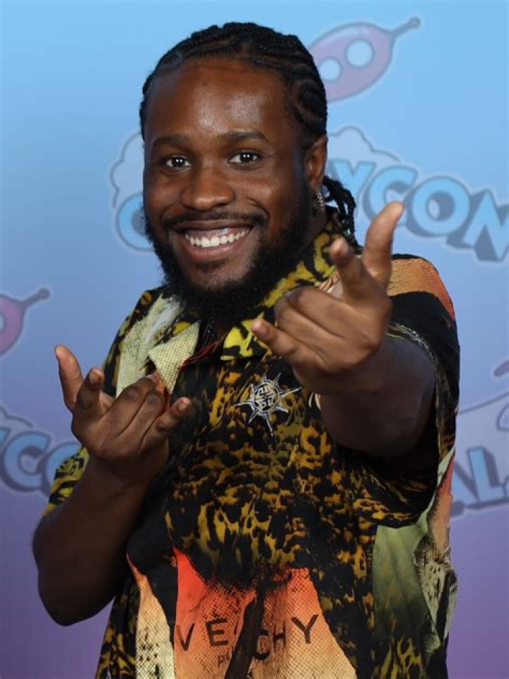 Shameik Moore Shameik Moore wearing a glittery black shirt