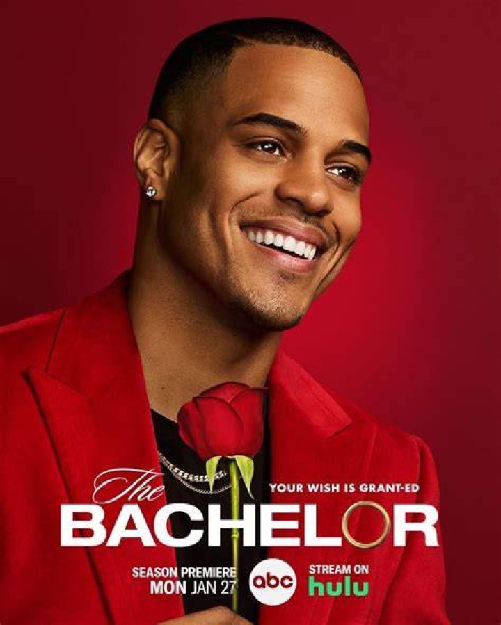 The Bachelor's Juan Pablo Galavis holding a rose smiling