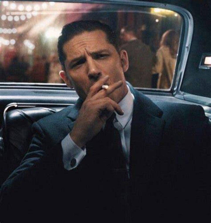 tom hardy smoking skull with a top hat tattoo