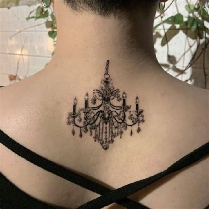 Viktorious Maximus back chandelier tattoo